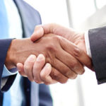 Two business people shaking hands